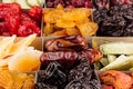 Assortment of dried fruits closeup background in square cells. Royalty Free Stock Photo