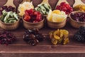 Assortment of dried fruits closeup on brown wooden background. Royalty Free Stock Photo