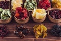 Assortment of dried fruits closeup on brown wooden background. Royalty Free Stock Photo