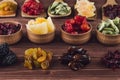 Assortment of dried fruits closeup on brown wooden background. Royalty Free Stock Photo