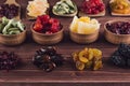 Assortment of dried fruits closeup on brown wooden background. Royalty Free Stock Photo