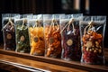 assortment of dried fruits and nuts in transparent packing on the shop shelf