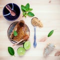 Assortment of dried herbs and fresh herbs tea. Honeycomb in ceramic plate with Fresh herbs peppermint , sage ,lime slice