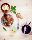 Assortment of dried herbs and fresh herbs tea. Honeycomb in ceramic plate with Fresh herbs peppermint , sage ,lime slice