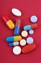 Assortment of drugs close-up on red background Royalty Free Stock Photo