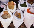 Assortment of dry cereal and beans in jute bags with price on street market Royalty Free Stock Photo
