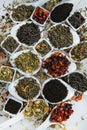 Assortment of dry tea. Various kinds of tea isolated on white.Different kinds of tea leaves. Tea composition with different kind