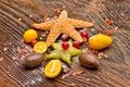 Assortment of exotic fruits, nuts and starfish Royalty Free Stock Photo