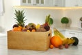 Assortment of exotic fruits on table in kitchen Royalty Free Stock Photo