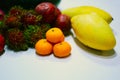 Assortment of exotic fruits on a white table Royalty Free Stock Photo