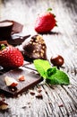 Assortment of fine chocolates and pralines with fresh strawberry