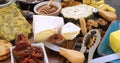 Assortment of French and British cheese with figs and walnuts