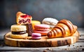 assortment of french pastry on a wooden background. toning.