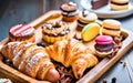 Assortment of French pastry on wooden table.