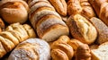 Assortment of fresh artisan breads featuring diverse shapes and textures Royalty Free Stock Photo