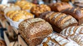 Assortment of fresh bakery breads with seeds on display Royalty Free Stock Photo