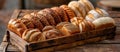 Assortment of Fresh Bread on Wooden Tray Royalty Free Stock Photo