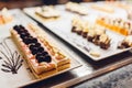 Assortment of fresh desserts displayed in hotel buffet. Variety of cakes in canteen ready for dinner Royalty Free Stock Photo