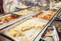 Assortment of fresh dishes displayed in hotel buffet. Variety of food in canteen ready for dinner Royalty Free Stock Photo