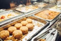 Assortment of fresh dishes displayed in hotel buffet. Variety of food in canteen ready for dinner Royalty Free Stock Photo