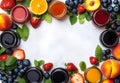 Assortment of fresh fruit jams in jars with fruit and leaves around the edges Royalty Free Stock Photo