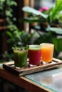 Assortment of fresh fruit juices in clear glasses on rustic wooden tray, healthy drinks concept Royalty Free Stock Photo