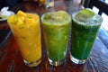 Assortment of fresh fruit smoothies in tall glasses