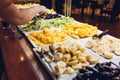 Assortment of fresh fruits displayed in hotel buffet. Variety of tropical exotic food in canteen ready for dinner Royalty Free Stock Photo