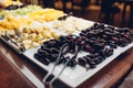 Assortment of fresh fruits displayed in hotel buffet. Variety of tropical exotic food in canteen ready for dinner Royalty Free Stock Photo