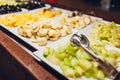 Assortment of fresh fruits displayed in hotel buffet. Variety of tropical exotic food in canteen ready for dinner Royalty Free Stock Photo