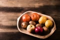 Assortment fresh healthy fruits in handmade wooden bowl made in Royalty Free Stock Photo