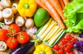 Assortment of fresh vegetables. Carrot garlic kohlrabi onion celery cucumber parsnip and radish on table.