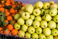 Apples and tangerines in greengrocery Royalty Free Stock Photo