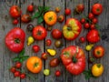 Assortment of fresh organic colorful tomatoes on wooden background. Royalty Free Stock Photo