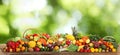 Assortment of fresh organic vegetables and fruits on wooden table against blurred green background. Banner design Royalty Free Stock Photo