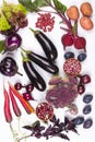 Assortment of fresh raw purple homegrown vegetables on white table. Royalty Free Stock Photo