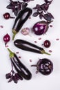 Assortment of fresh raw purple homegrown vegetables on white table. Royalty Free Stock Photo