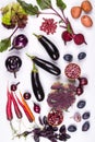 Assortment of fresh raw purple homegrown vegetables on white table. Royalty Free Stock Photo