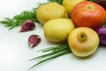 Assortment of fresh raw vegetables on white background. Selection includes potato, tomato, green onion, garlic and dill Royalty Free Stock Photo
