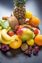 Assortment of Fresh Tropical and Summer Seasonal Fruits Pineapple Papaya Mango Coconut Oranges Kiwi Bananas Lemons Grapefruit Royalty Free Stock Photo