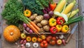 An assortment of fresh vegetables is displayed on a rustic wooden surface Royalty Free Stock Photo