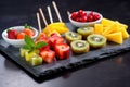 assortment of fruit skewers on a slate plate Royalty Free Stock Photo