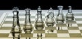 Assortment of glass chess pieces on board with orange and green shade Royalty Free Stock Photo