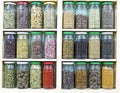 assortment of glass jars on shelves in herbalist shop in marrakesh, morocco, containing herbs and spices for medicinal and