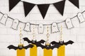 Assortment of Halloween yellow drinks with paper bats