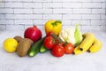 Assortment of healthy food, fresh green red yellow organic vegetables. cucumber, bell pepper, tomatoes, cauliflower on Royalty Free Stock Photo