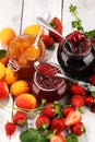 Assortment of jams, seasonal berries, apricot, mint and fruits. marmalade or confiture Royalty Free Stock Photo