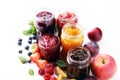 Assortment of jams, seasonal berries, plums, mint and fruits