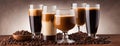 Assortment of Layered Coffee Drinks in Various Glasses with Beans on Wood