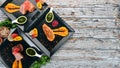 Assortment of meat dishes. Chicken meat, veal and pork with sauce. On a wooden background.